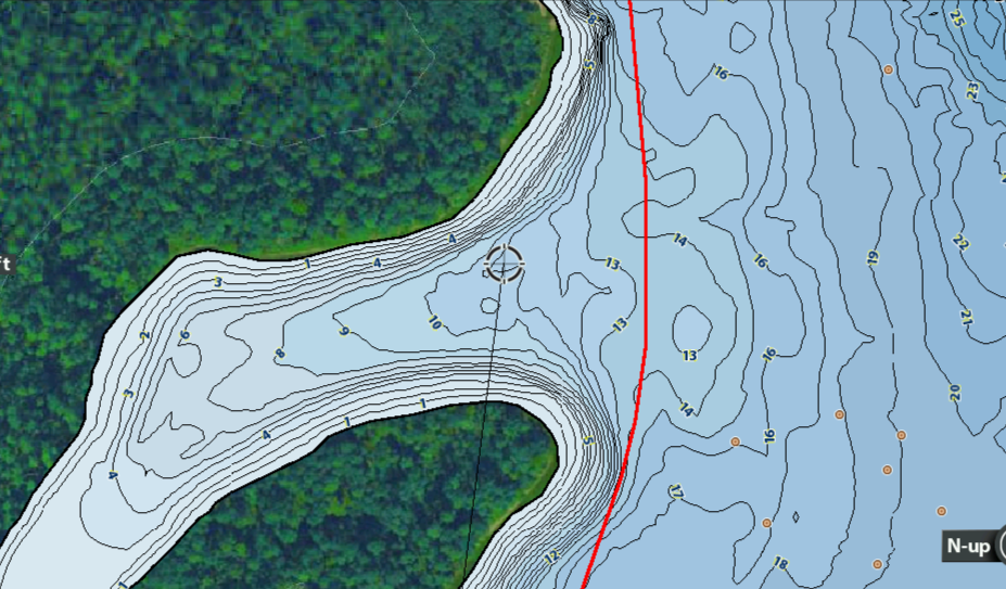 Closuep screenshot of a Humminbird Fishfinder showing a Fishing Map Cards Lake Conroe Boat Lane in red over a contour map of Lake Conroe. 