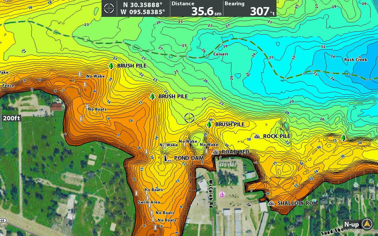 A screenshot of a map on a Humminbird fishfinder depicting multiple waypoints in an area like: a road bed, pond dam, rock pile, and burns piles.